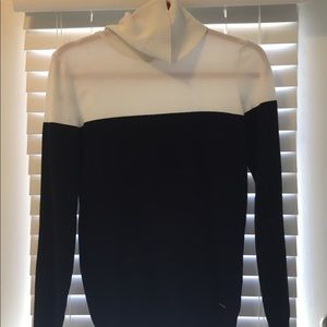 Black and white Calvin Klein turtle neck sweater.